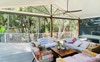 Entertaining deck looks out to private forest