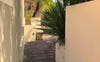 Pathway to back tropical garden 