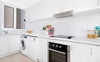 Kitchen - right hand side has opening to dining