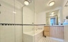 Shower, full bath, and vanity.