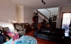 Living room, looking at dining table & front door.