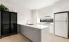 Bright kitchen with a fridge, freezer, dishwasher