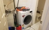 Laundry with washing machine, extra toilet