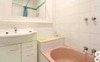 Shared bathroom with relaxing pink bath 