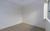 With a queen bed, bedside table & wardrobe 