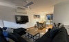 Living and dining area with Smart TV and speaker