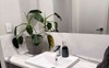 Shared vanity with mirror, lots of cupboard space.