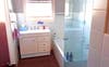 Bathroom with laundry off to the left 