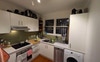 Kitchen with washing machine and dishwasher 