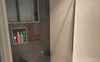 Shared bathroom, large shower and small bath.