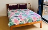 Bed side table with lamp in courtyard bedroom 