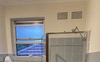 Bathroom with shower, bathtub and bidet shower 