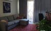 Living room has AC, couch, dining tables